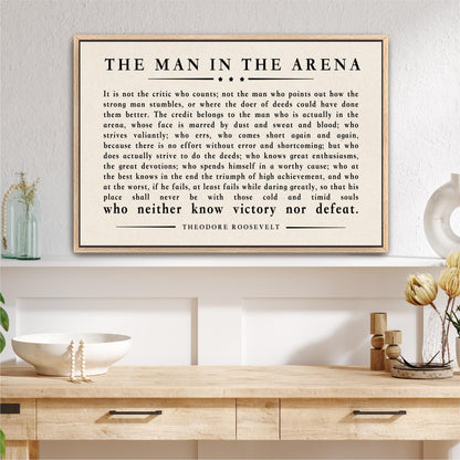 a framed quote by Theodore Roosevelt, which is a powerful piece of literature that discusses the importance of perseverance and determination in the face of challenges and adversity.