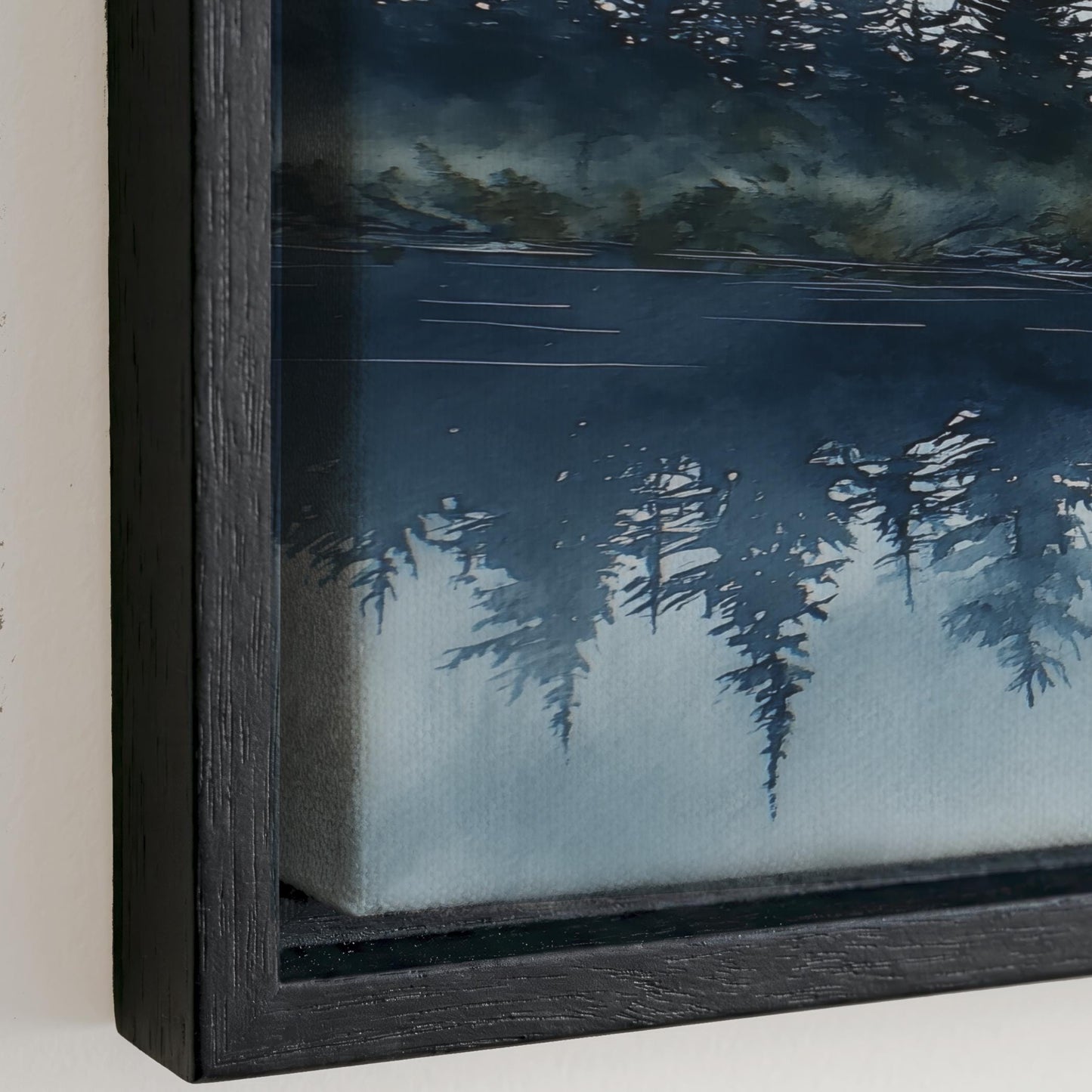 The image is a framed painting depicting a serene landscape with a forest and a body of water.