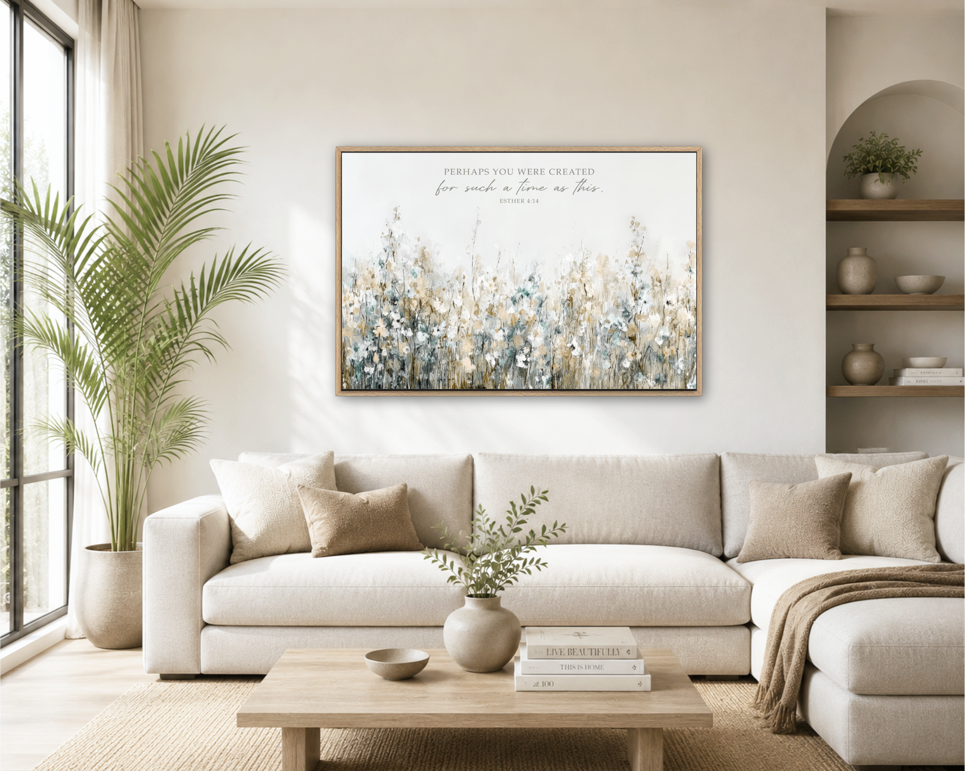 a cozy living room with a large white sofa, a wooden coffee table, and a framed painting of a field of flowers hanging on the wall.