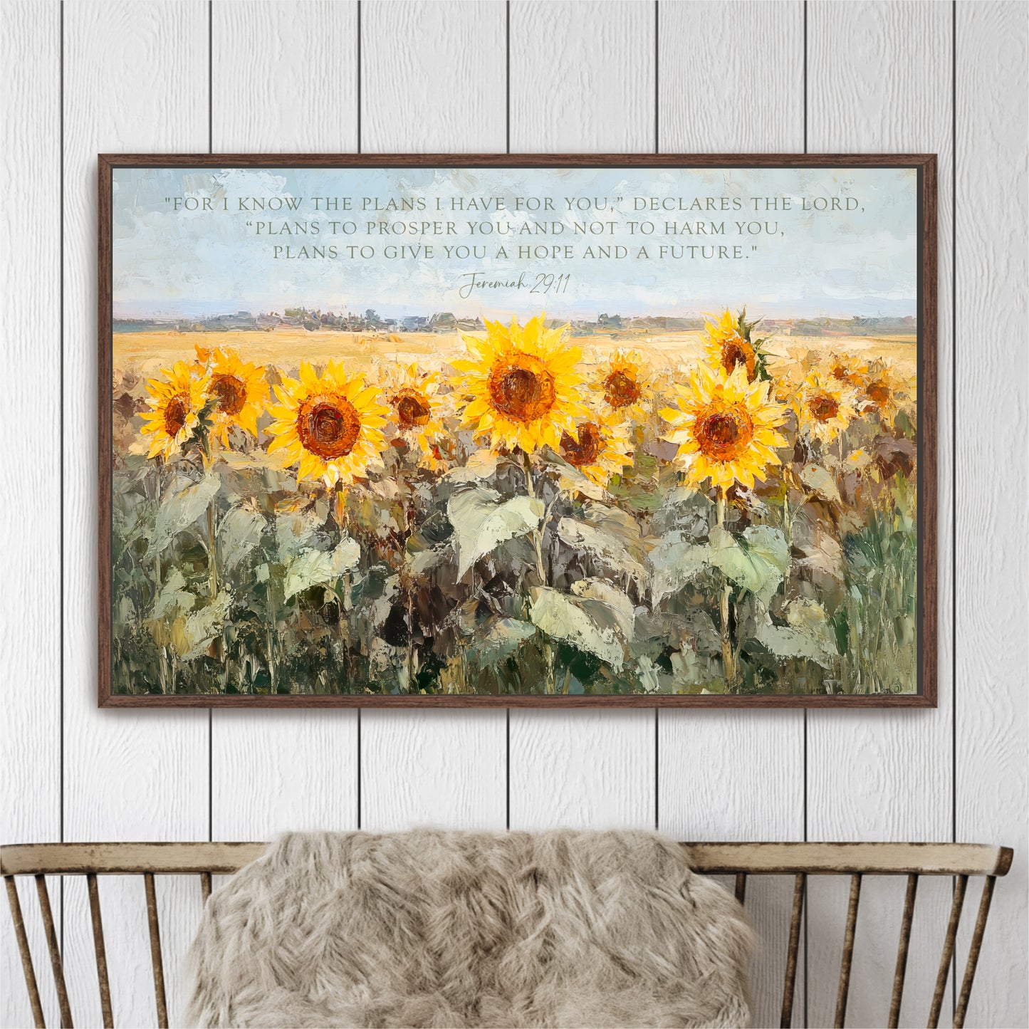 The image is a framed painting of a field of vibrant yellow sunflowers.