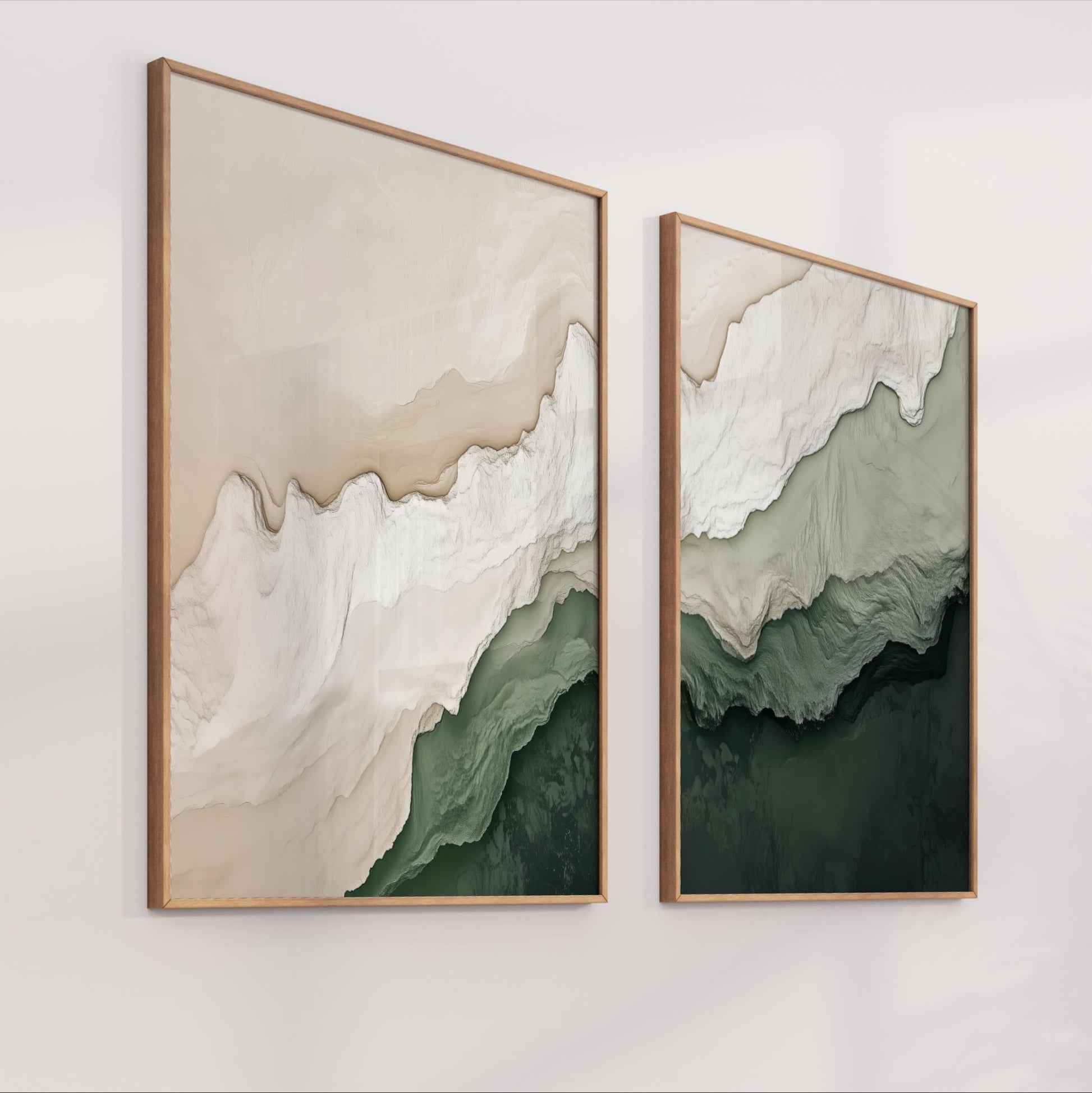 two framed artworks hanging on a wall, depicting abstract landscapes with a blend of green and white colors.