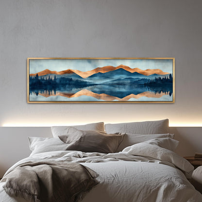 a large, framed painting of a serene landscape with mountains, trees, and a lake, hanging above a bed with white bedding.