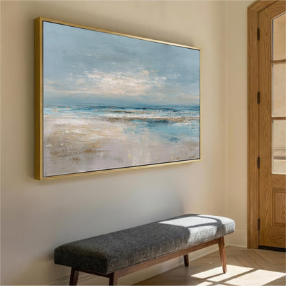 a large painting of a serene landscape hanging on a wall, with a wooden bench placed in front of it.