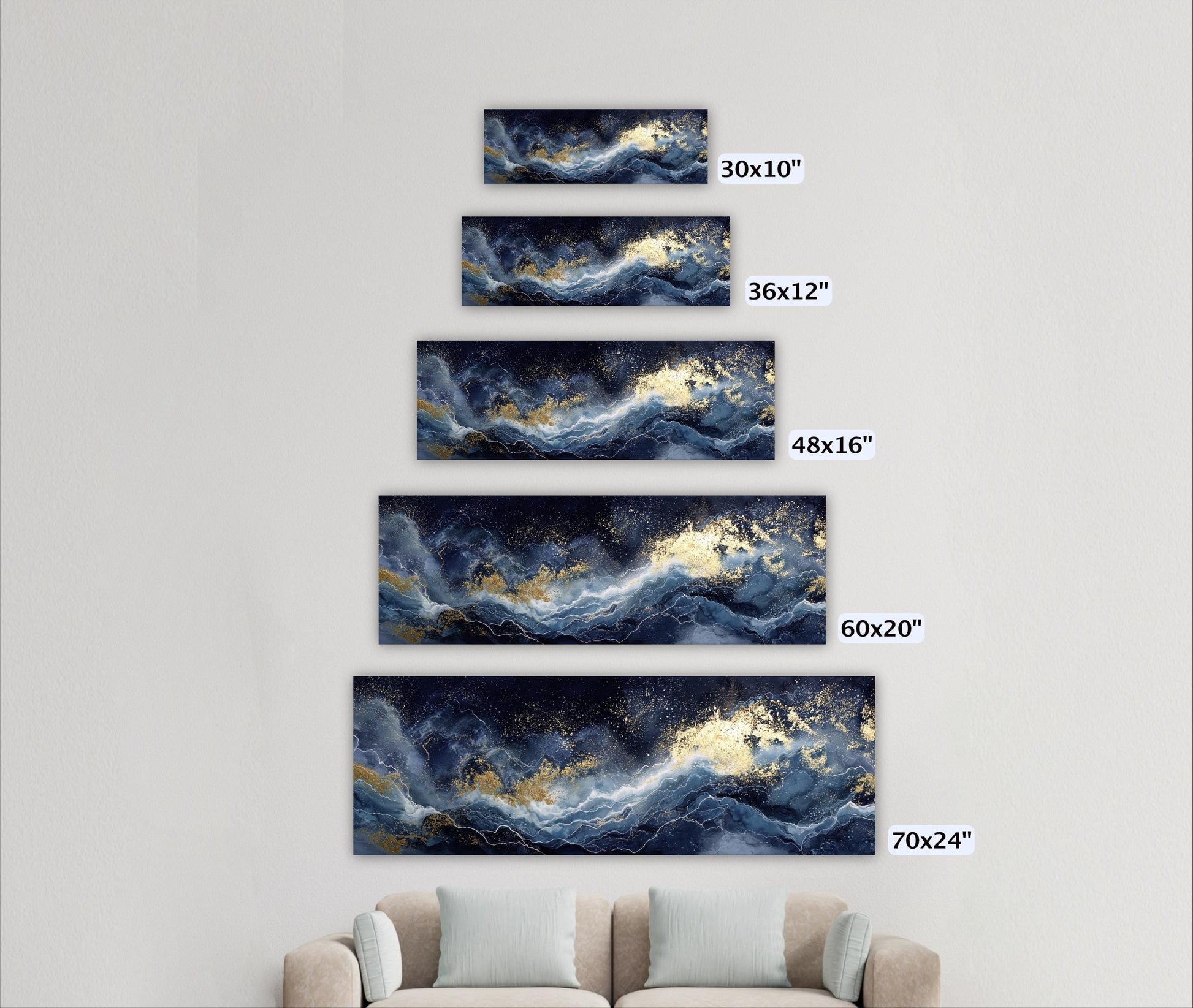 A wall with five framed artworks of varying sizes, each depicting a different ocean wave pattern in shades of blue and gold.