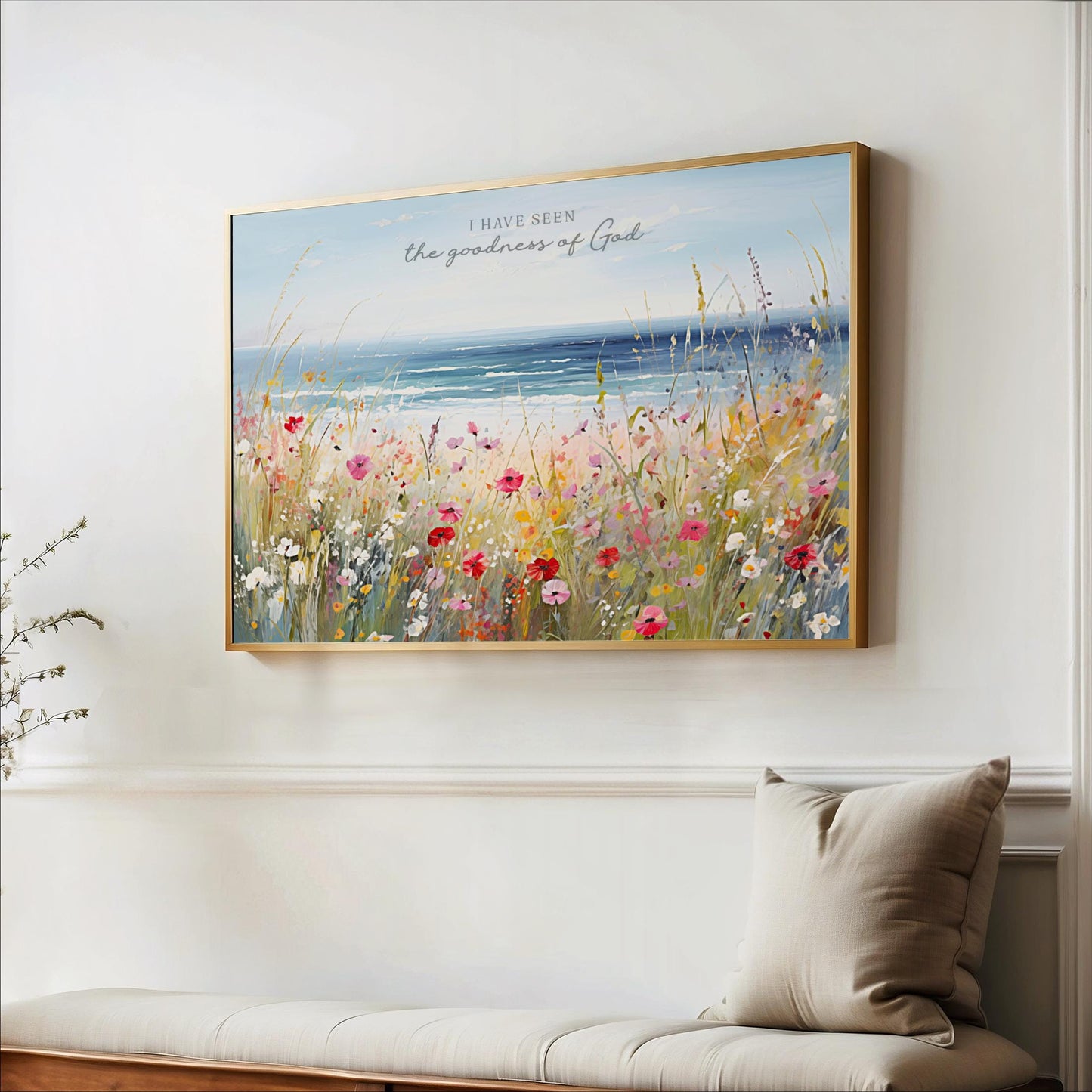 a large, framed painting of a field of colorful flowers hanging on a wall.