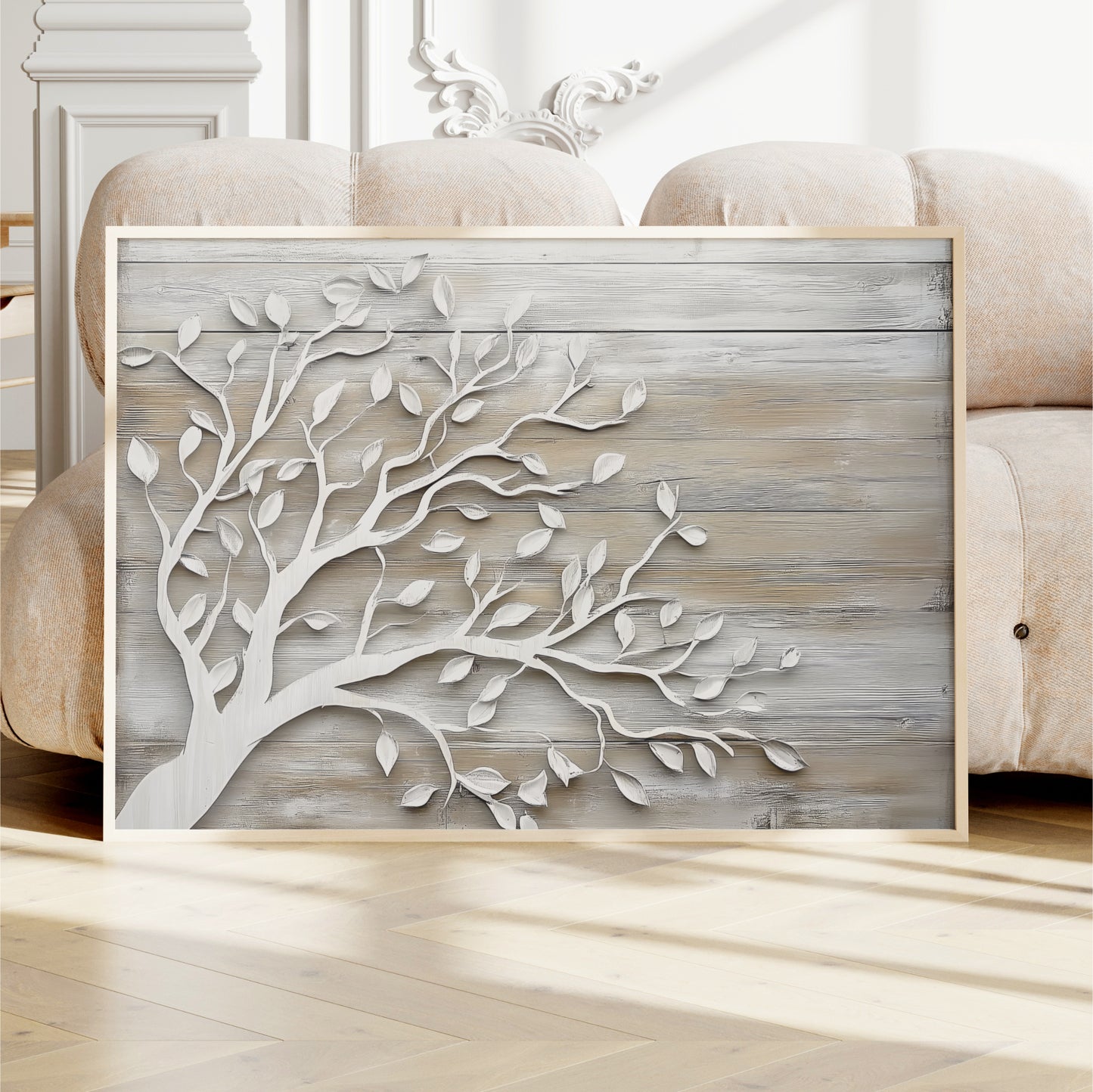a wooden wall with a decorative tree design, and there is a framed picture of a tree on the wall.