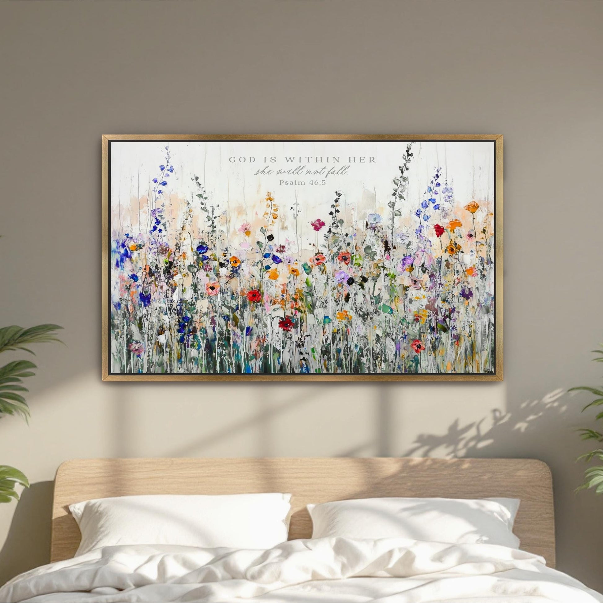 a large, colorful painting of a field of flowers hanging on a wall above a bed.