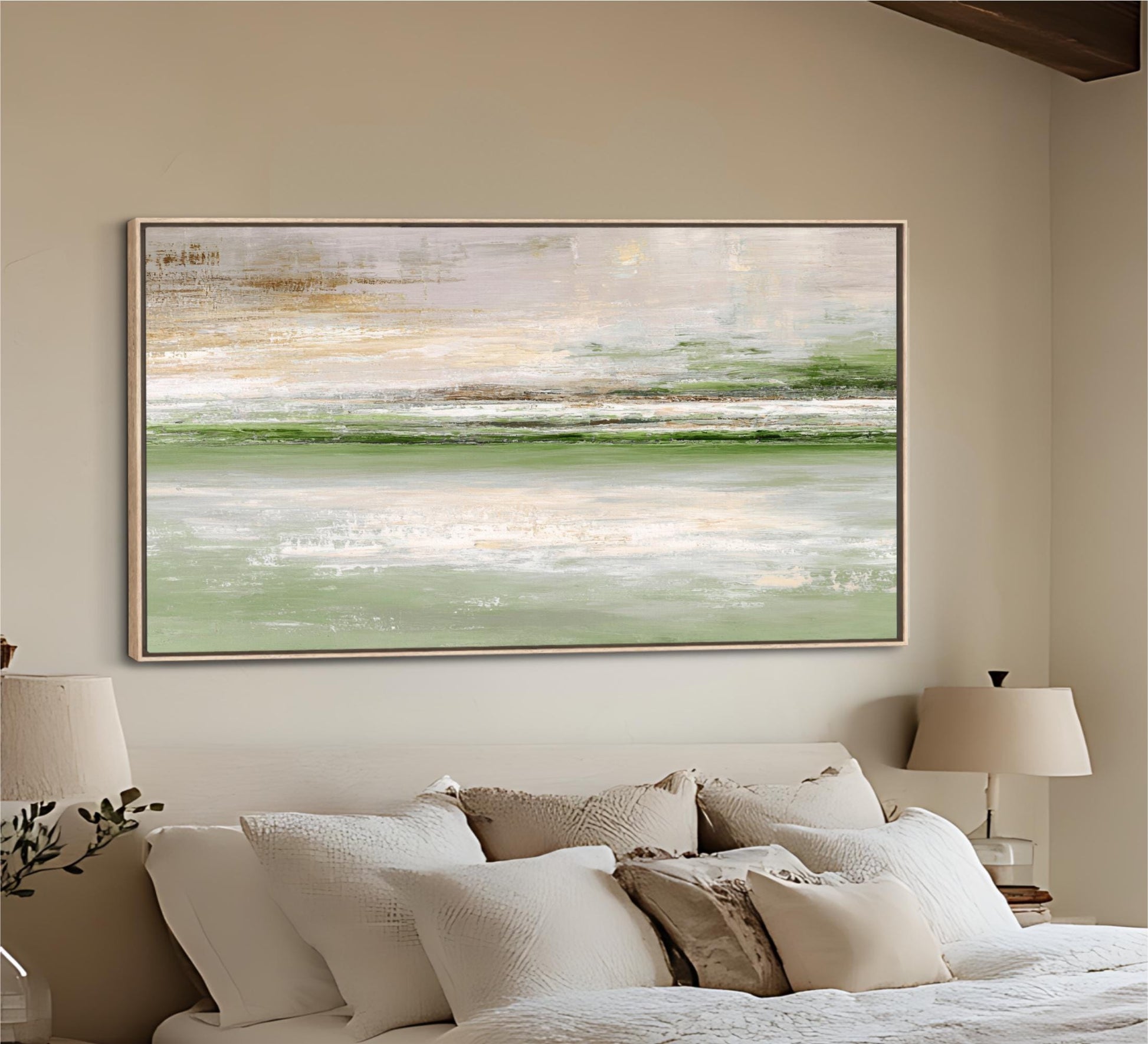 a large, framed painting of a serene landscape hanging on a wall above a bed with white bedding and pillows.