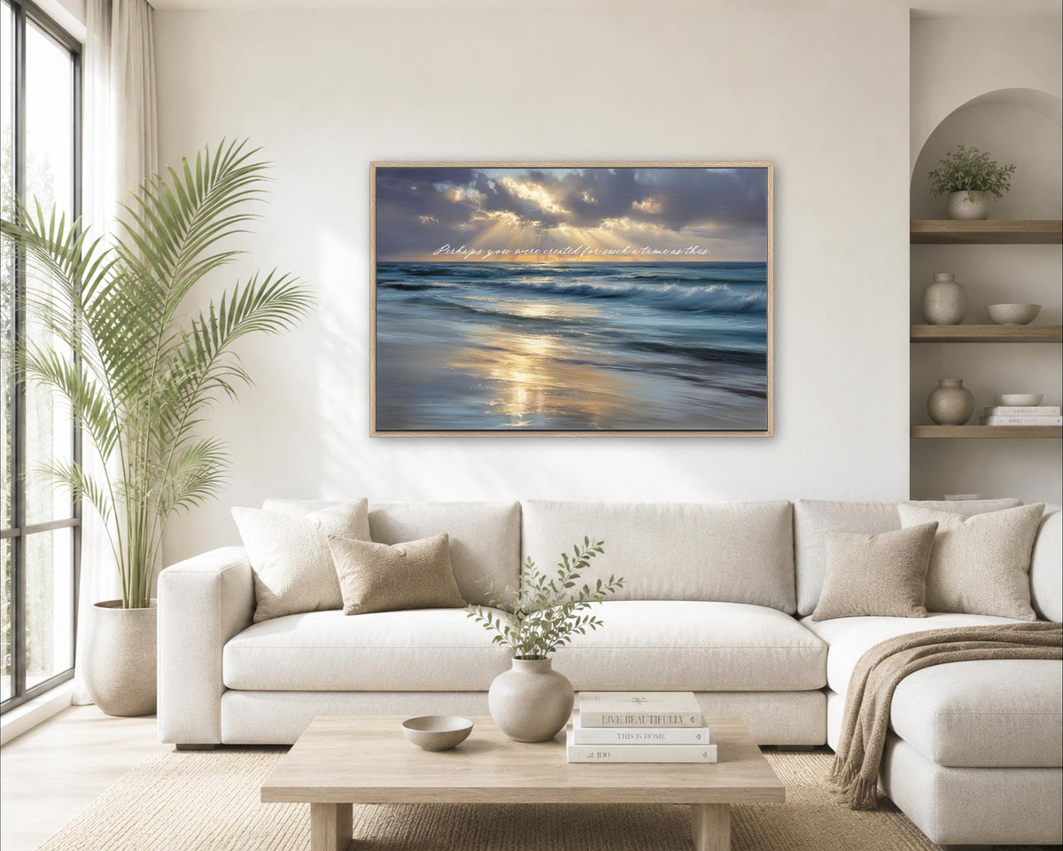 a serene living room with a large window overlooking a beach, a white sofa, a wooden coffee table, and a framed painting of a beach scene hanging on the wall.
