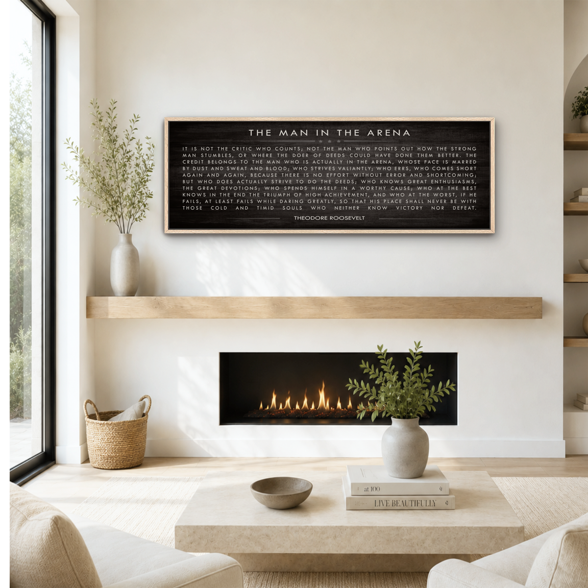 a cozy living room with a fireplace, a wooden shelf, and a framed quote on the wall.