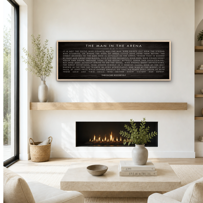 a cozy living room with a fireplace, a wooden shelf, and a framed quote on the wall.