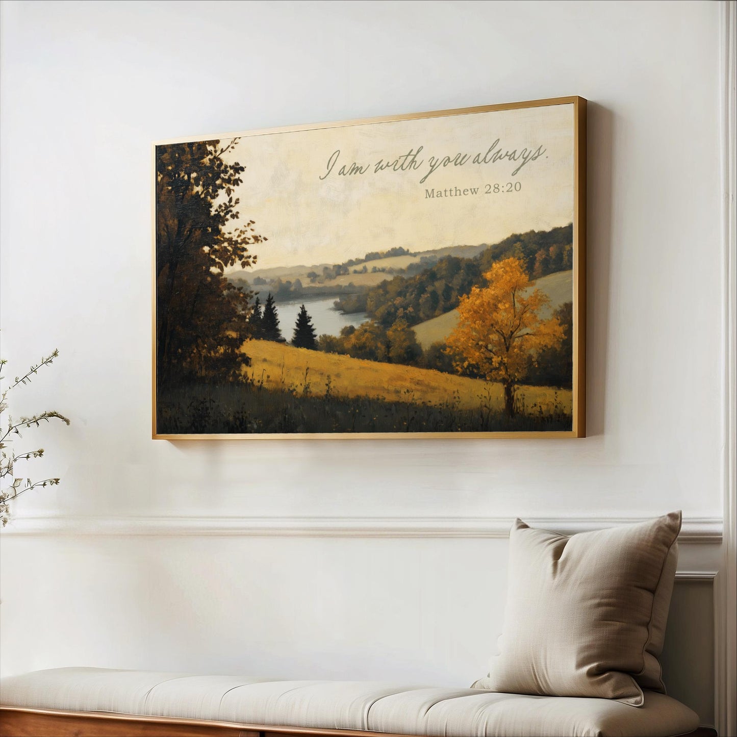 a painting of a serene landscape with a lake and trees, hanging on a wall above a couch with a pillow.