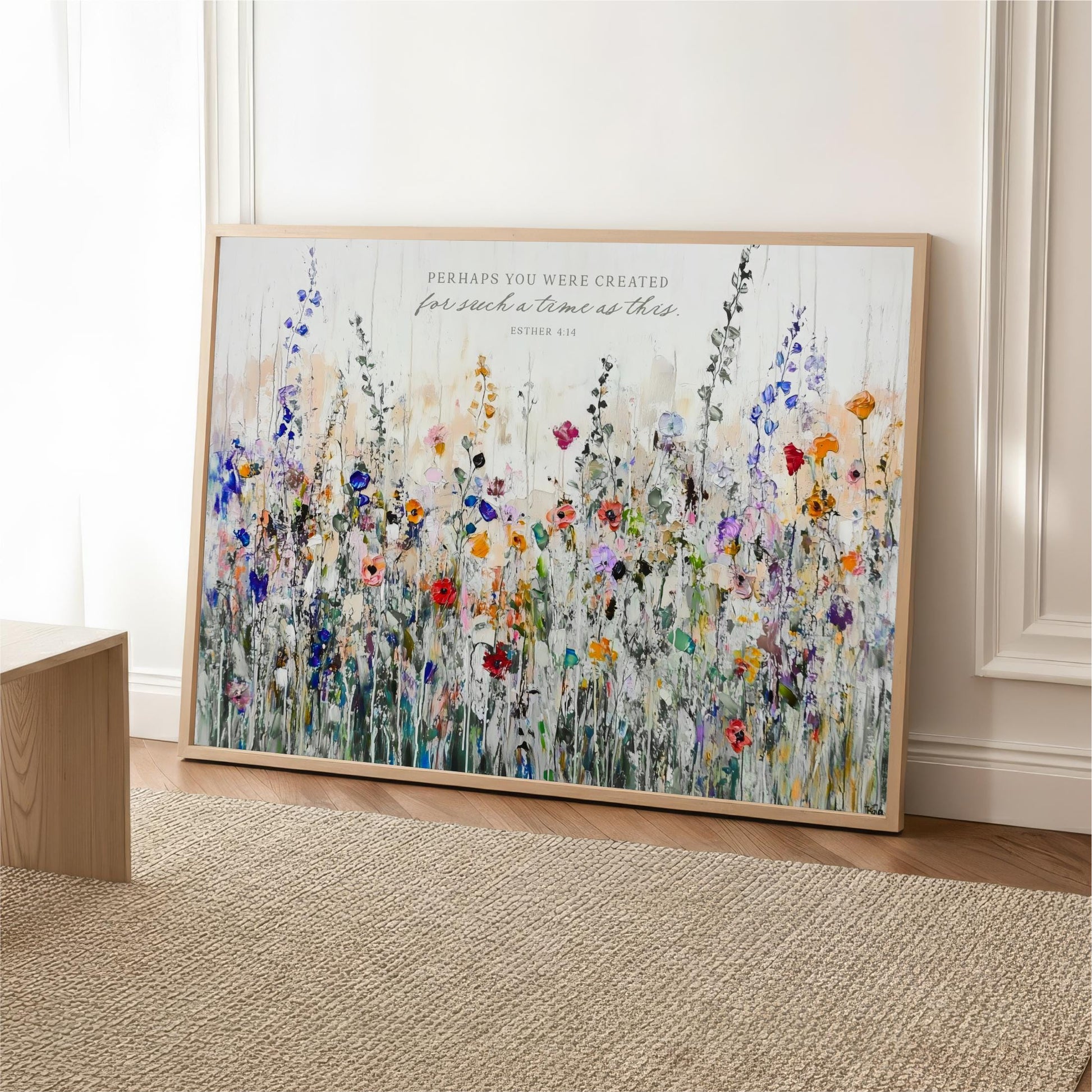 The image is a large framed print of a colorful painting depicting a field of flowers.