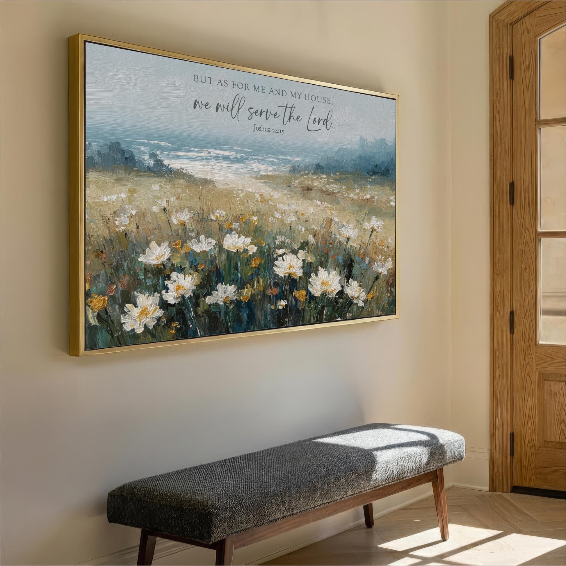 a large painting of a field of flowers hanging on a wall, with a bench in front of it.