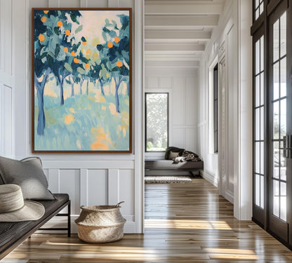 a large painting of a tree-filled landscape hanging on a wall, with a wooden floor and a window in the background.