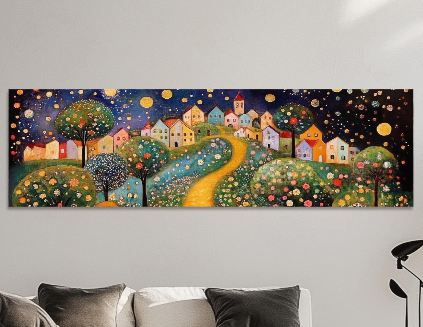 a living room with a white couch and a painting on the wall