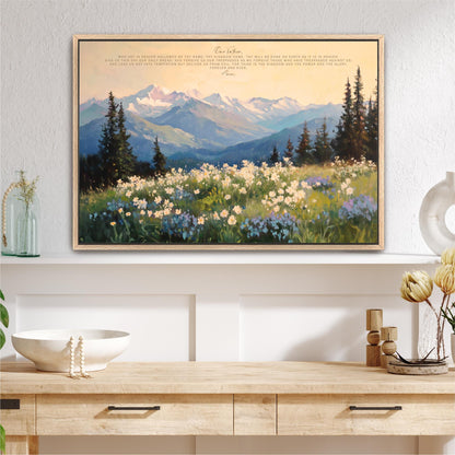a large framed painting of a mountainous landscape with a field of flowers in the foreground.