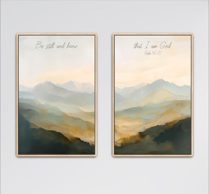 two framed paintings of a landscape with mountains in the background. The text on the paintings reads "Be still and know" and "That I am God" from the Bible verse Psalm 16:10.
