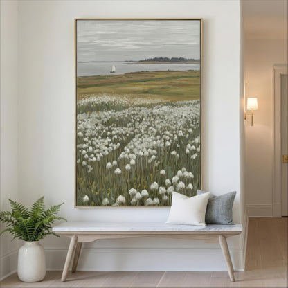 a large painting of a field with white flowers hanging on a wall, accompanied by a wooden bench and a potted plant in the corner.
