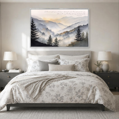 a serene bedroom scene with a large bed, a nightstand on each side, and a framed landscape painting above the bed. The painting depicts a mountain landscape with trees and a hazy, golden sky.
