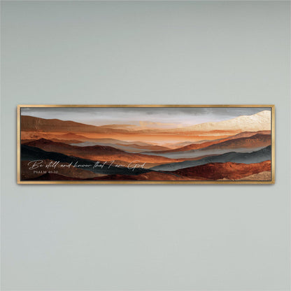 The image is a framed painting depicting a scenic landscape with mountains in the background and a warm, orange-toned sky.