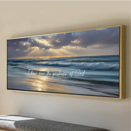 The image is a framed painting depicting a serene beach scene with a sunset over the ocean.