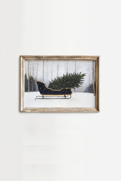A framed painting depicting a black sled carrying a large Christmas tree in a snowy forest.