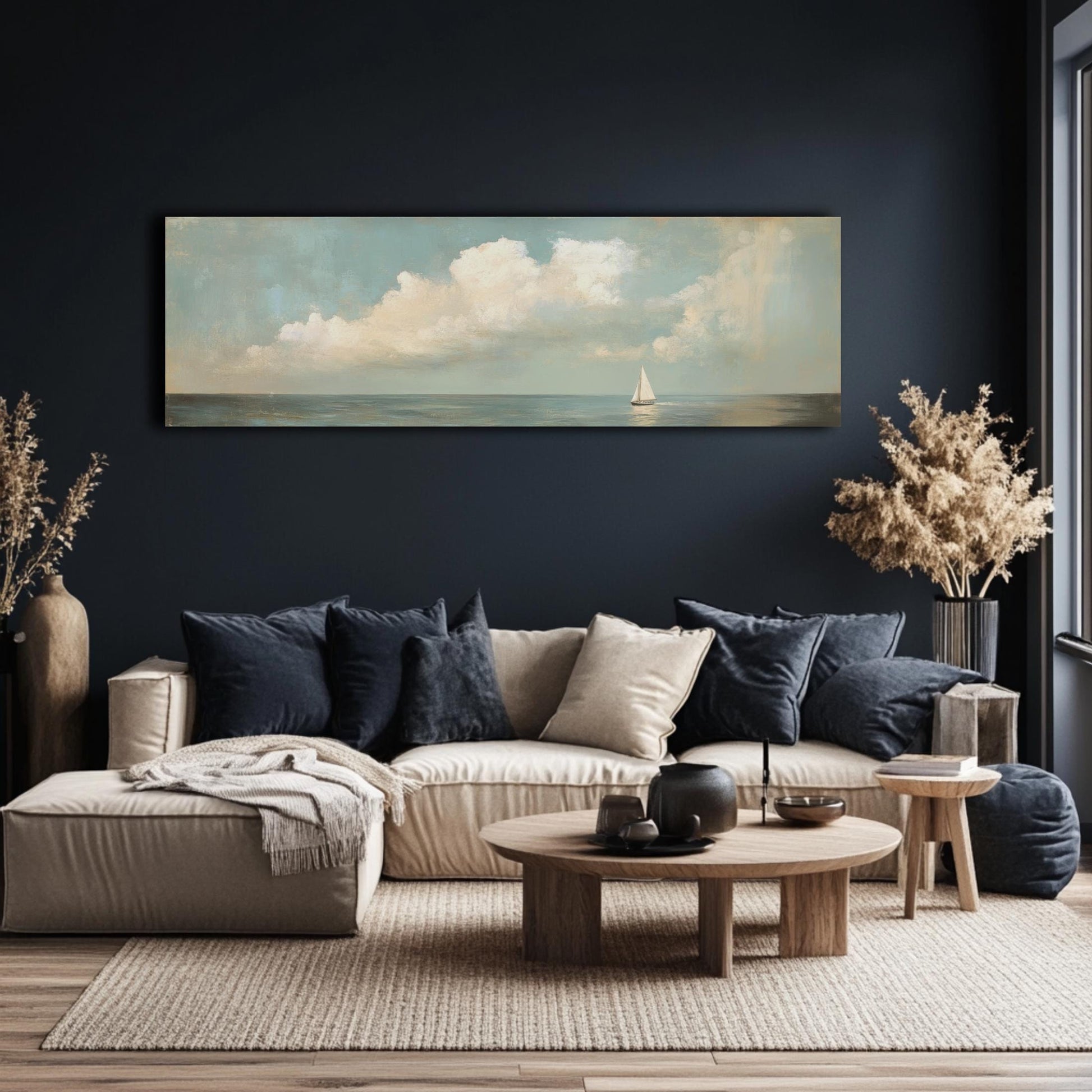 a modern living room with a large painting of a sailboat on the wall, a wooden coffee table, and a comfortable sofa with throw pillows.