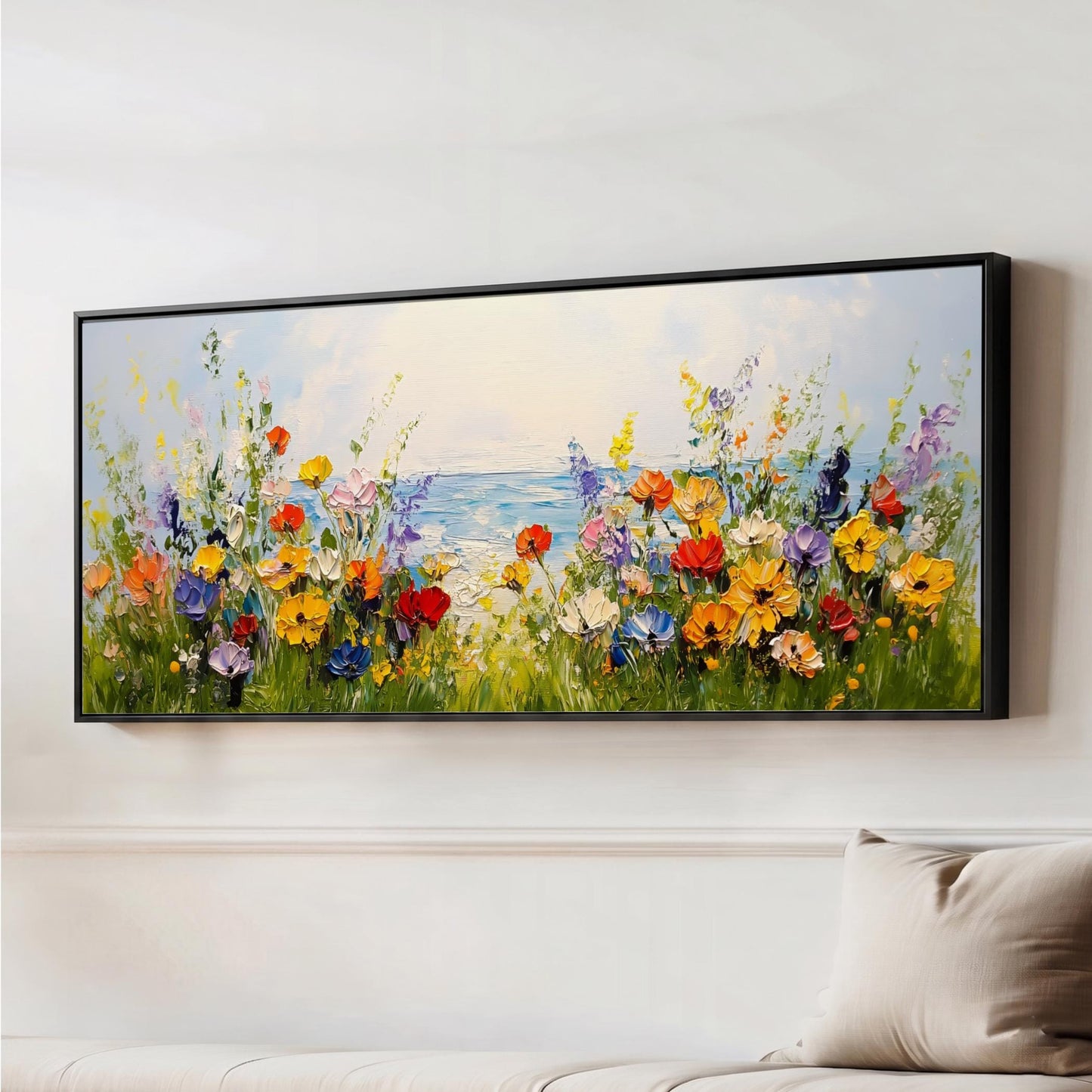 a large, colorful painting of a field of flowers with a body of water in the background.