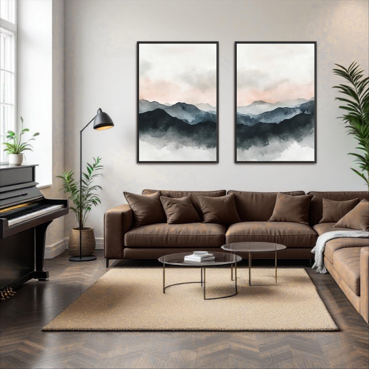 a modern living room with a brown leather sofa, a glass coffee table, and two framed landscape paintings on the wall.