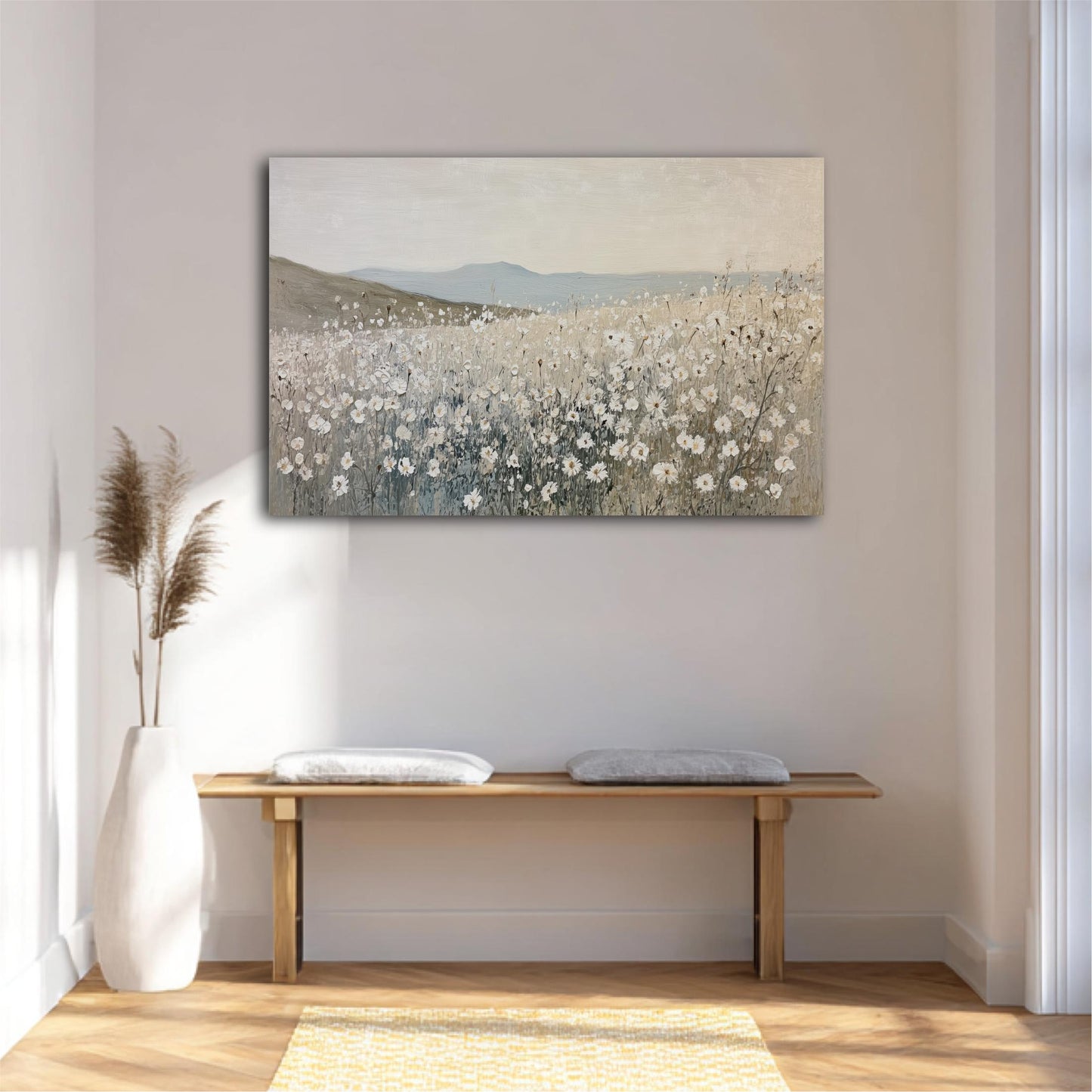 a serene and minimalist interior design with a large painting of a field of flowers hanging on the wall above a wooden bench with two cushions. The painting adds a touch of natural beauty to the space, while the bench provides a comfortable seating area. The overall design creates a calm and inviting atmosphere.