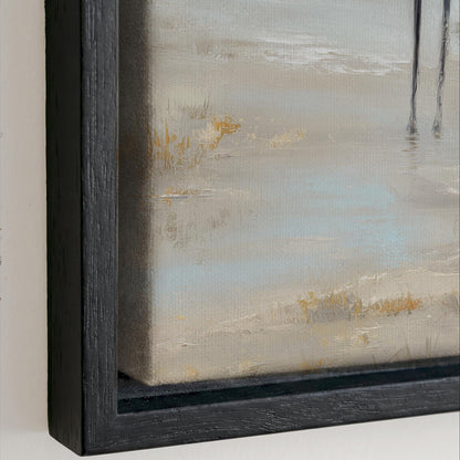The image is a painting of a beach scene, with a sandy beach and a body of water in the background. The painting is framed in a black frame and is displayed on a wall.