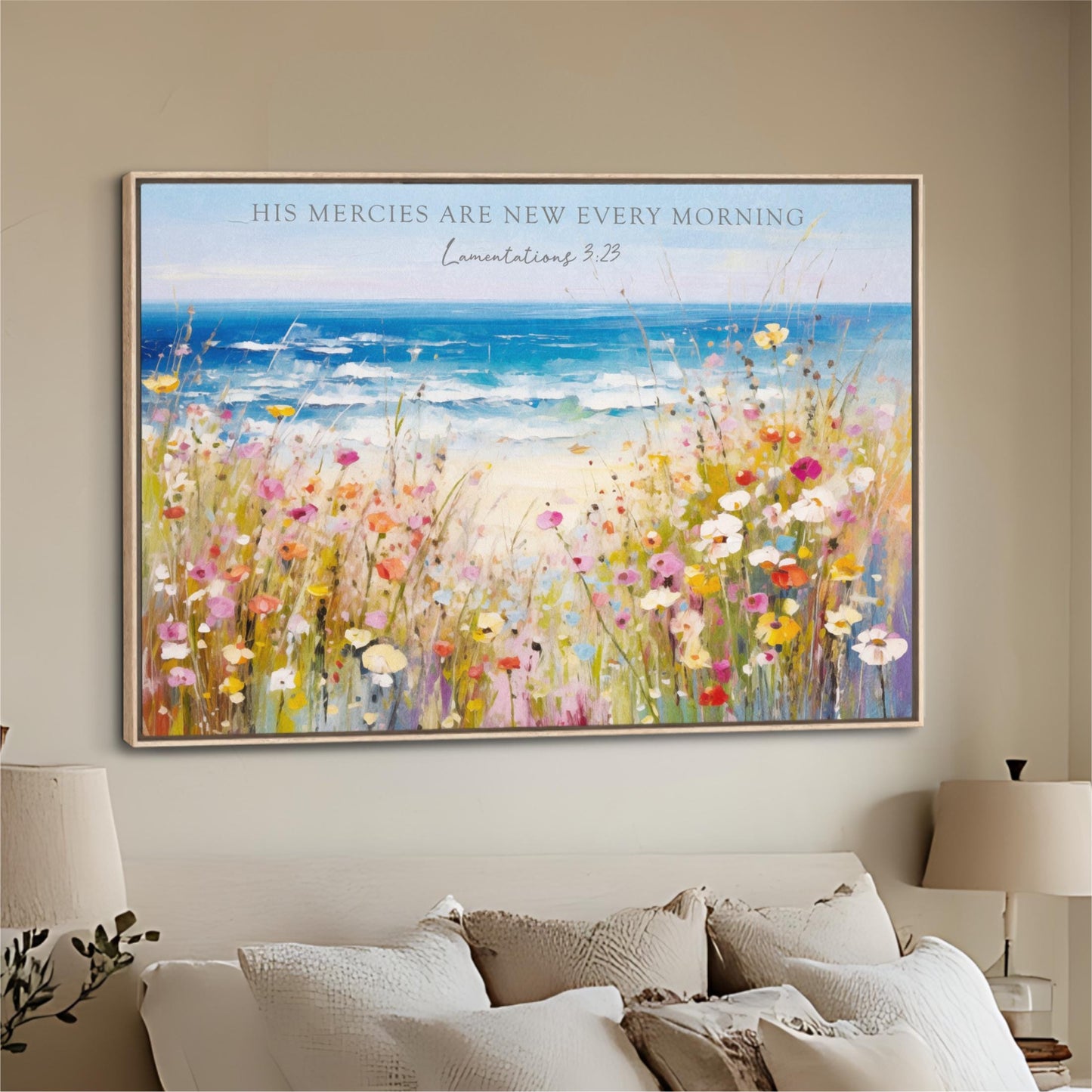 The image is a large framed painting hanging on a wall, depicting a vibrant field of flowers with a serene ocean view in the background.