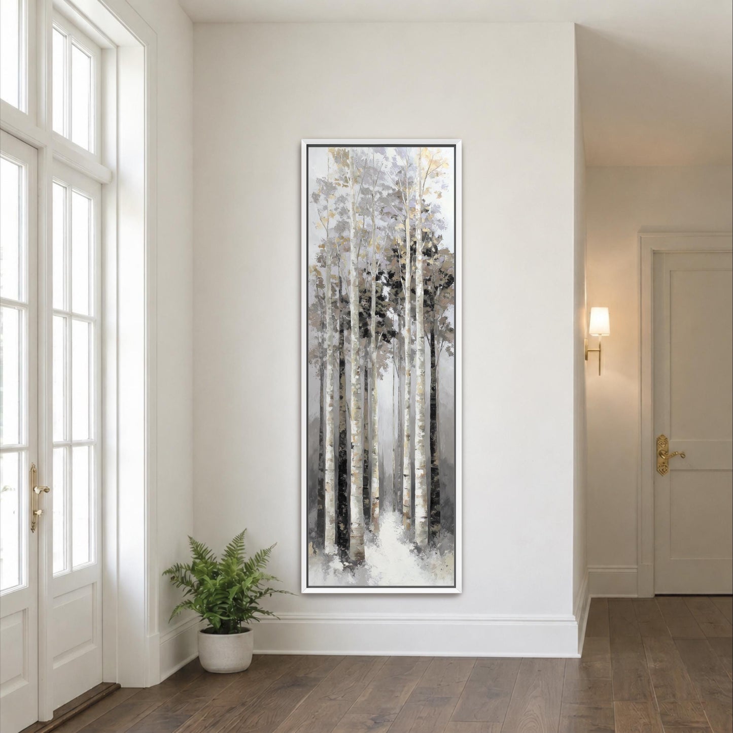 a large painting of a forest scene hanging on a white wall in a room with a wooden floor.