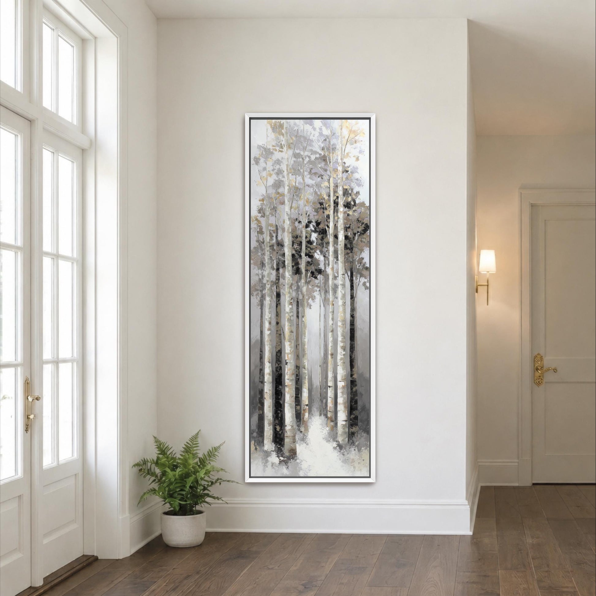 a large painting of a forest scene hanging on a white wall in a room with a wooden floor.