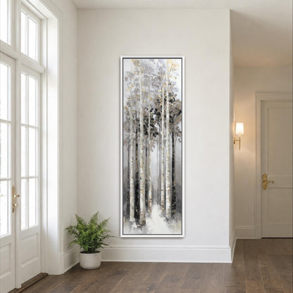a large painting of a forest scene hanging on a white wall in a room with a wooden floor.