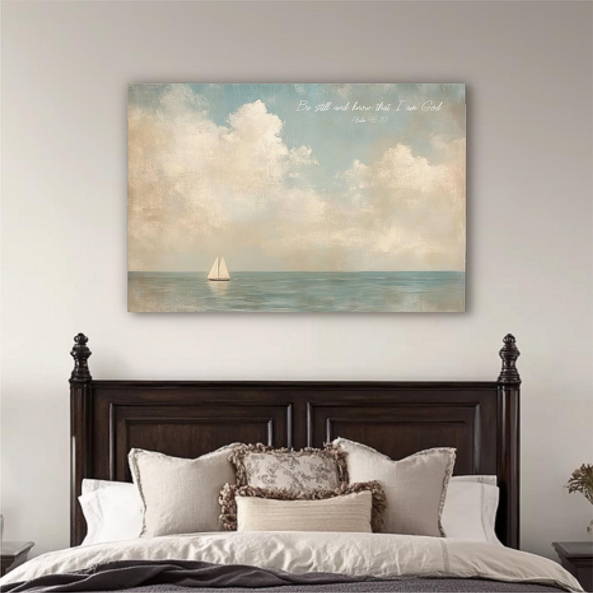 a large painting of a sailboat on the ocean, hanging above a bed with a wooden headboard.