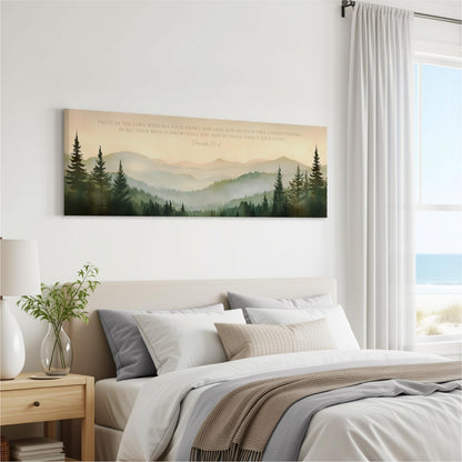 a bedroom with a large bed, a nightstand, and a painting of a forest landscape hanging on the wall above the bed.
