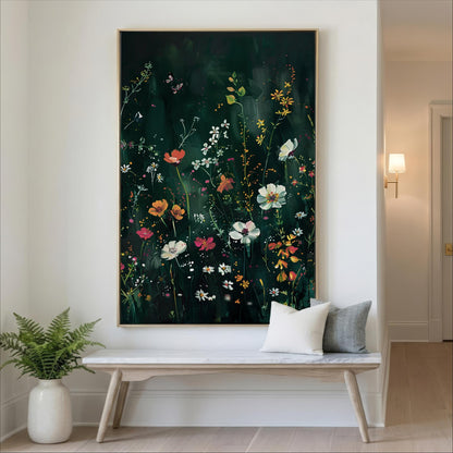 a large painting of a vibrant floral scene hanging on a wall, with a white bench and a potted plant placed in front of it.