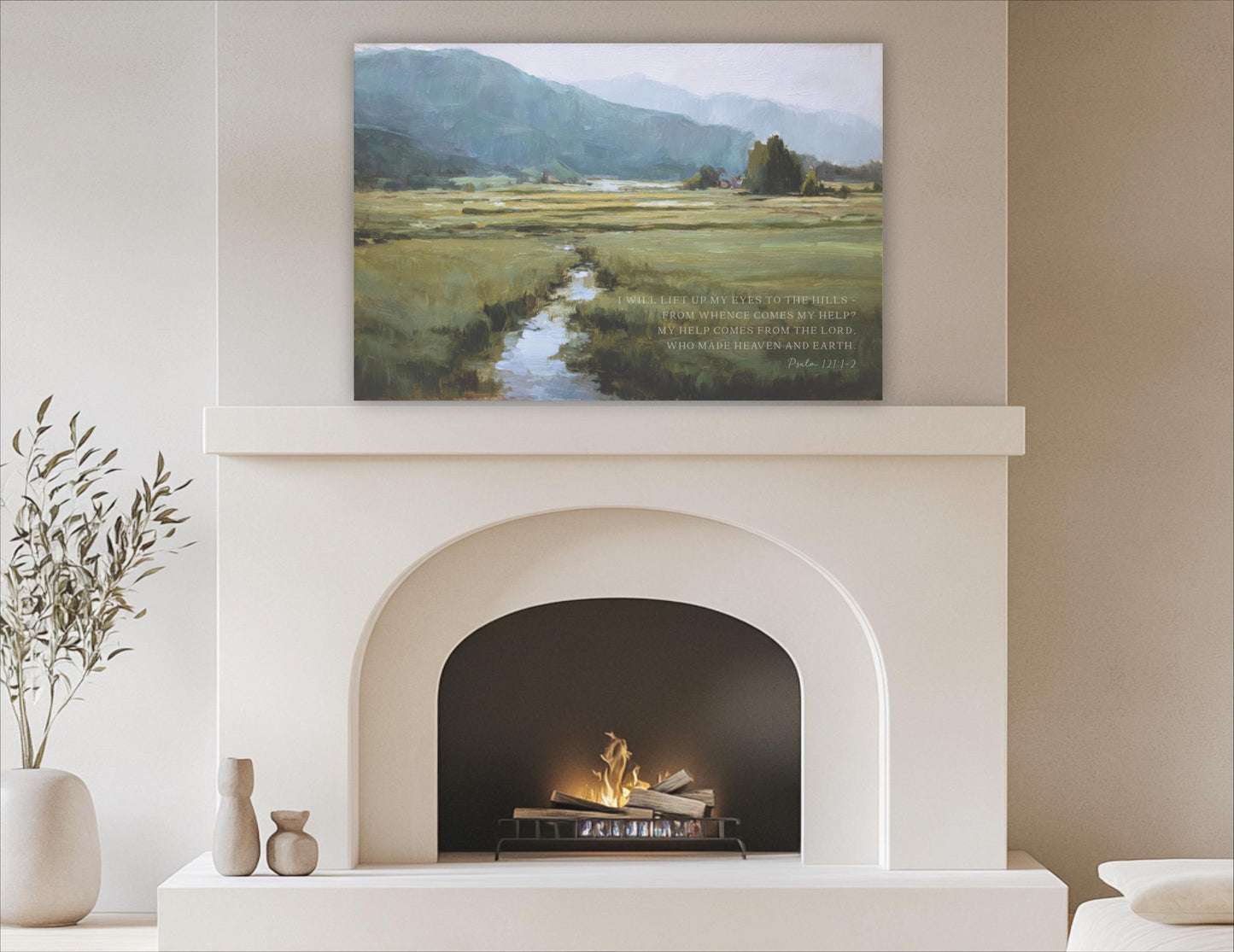 a cozy living room with a white fireplace and a painting of a serene landscape above it. The painting depicts a winding river surrounded by lush greenery, creating a peaceful and inviting atmosphere.
