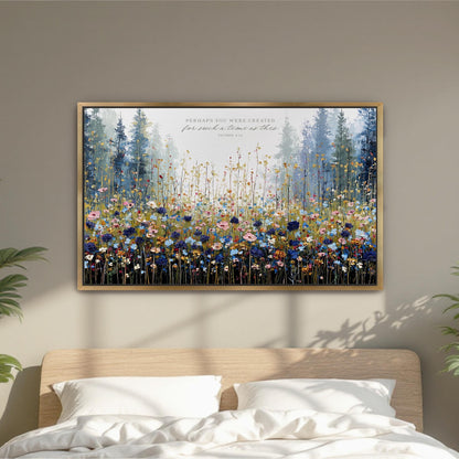 a large, framed painting of a field of flowers hanging on a wall above a bed.