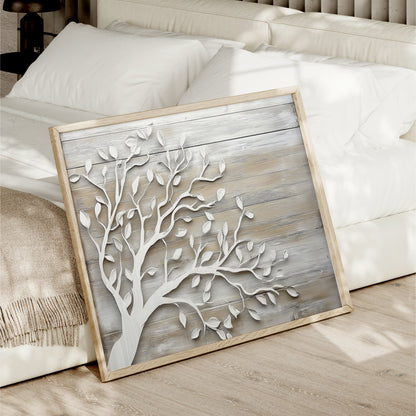 a wooden frame with a white tree design on it, placed on a wooden floor next to a white bed.