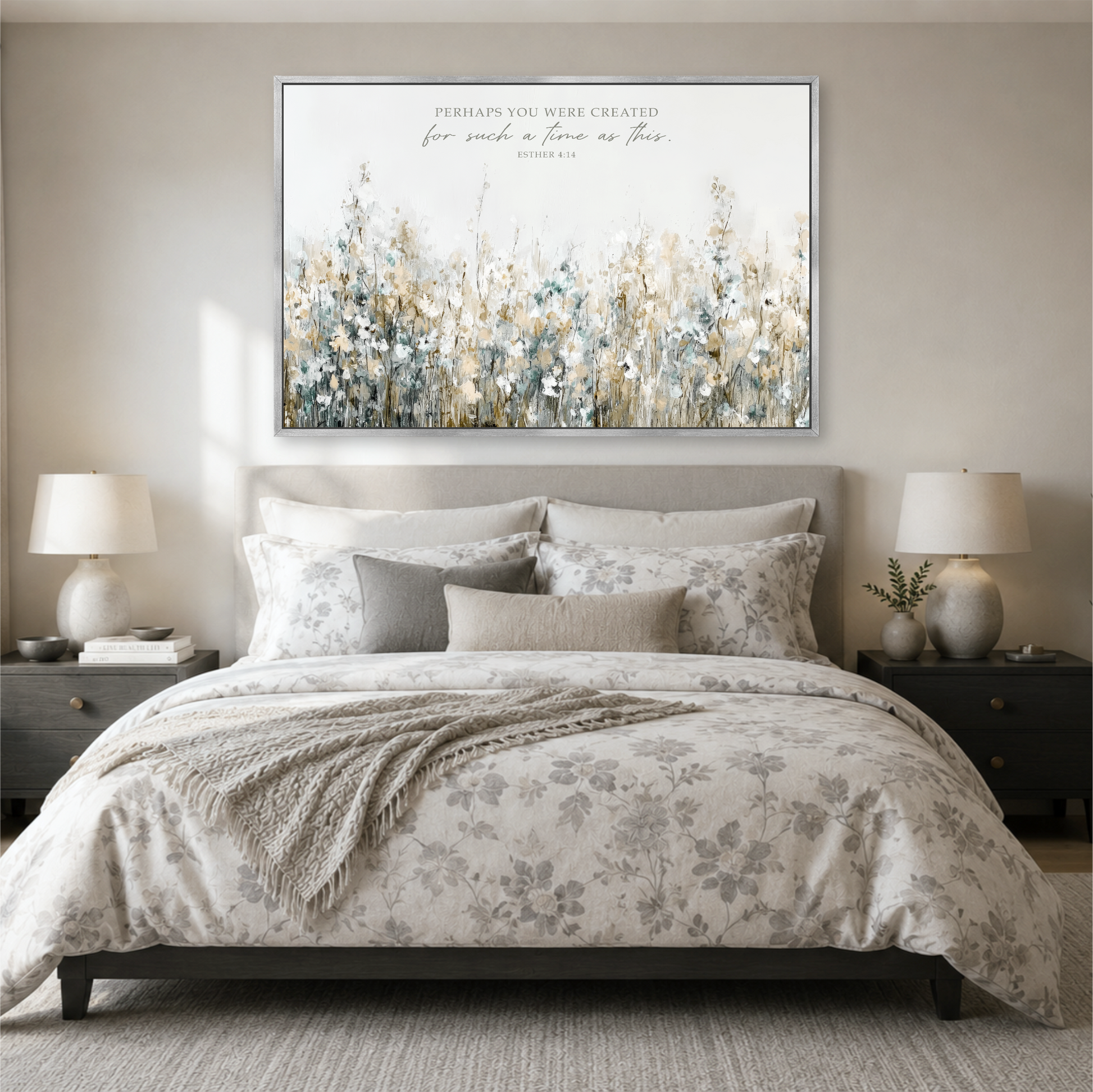 a serene bedroom scene with a large floral print on the wall above a bed with a gray and white floral comforter.