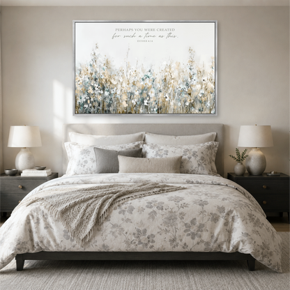 a serene bedroom scene with a large floral print on the wall above a bed with a gray and white floral comforter.
