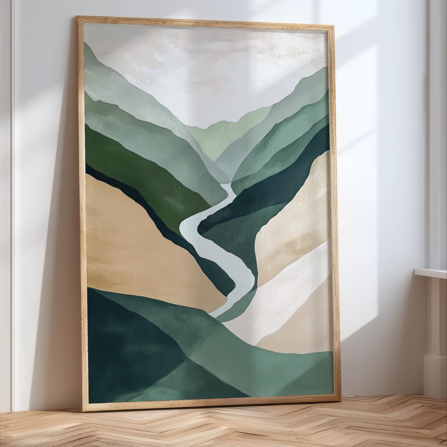 a large, framed painting depicting a mountainous landscape with a winding path through the hills.