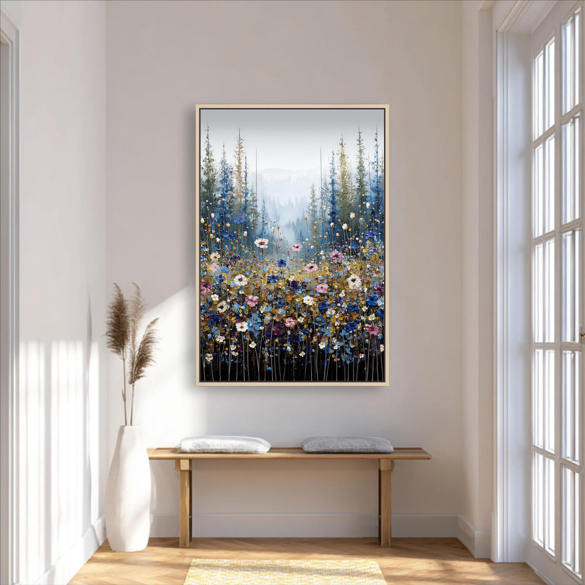 a large painting of a field of flowers hanging on a wall in a room with a wooden bench and a vase of flowers.