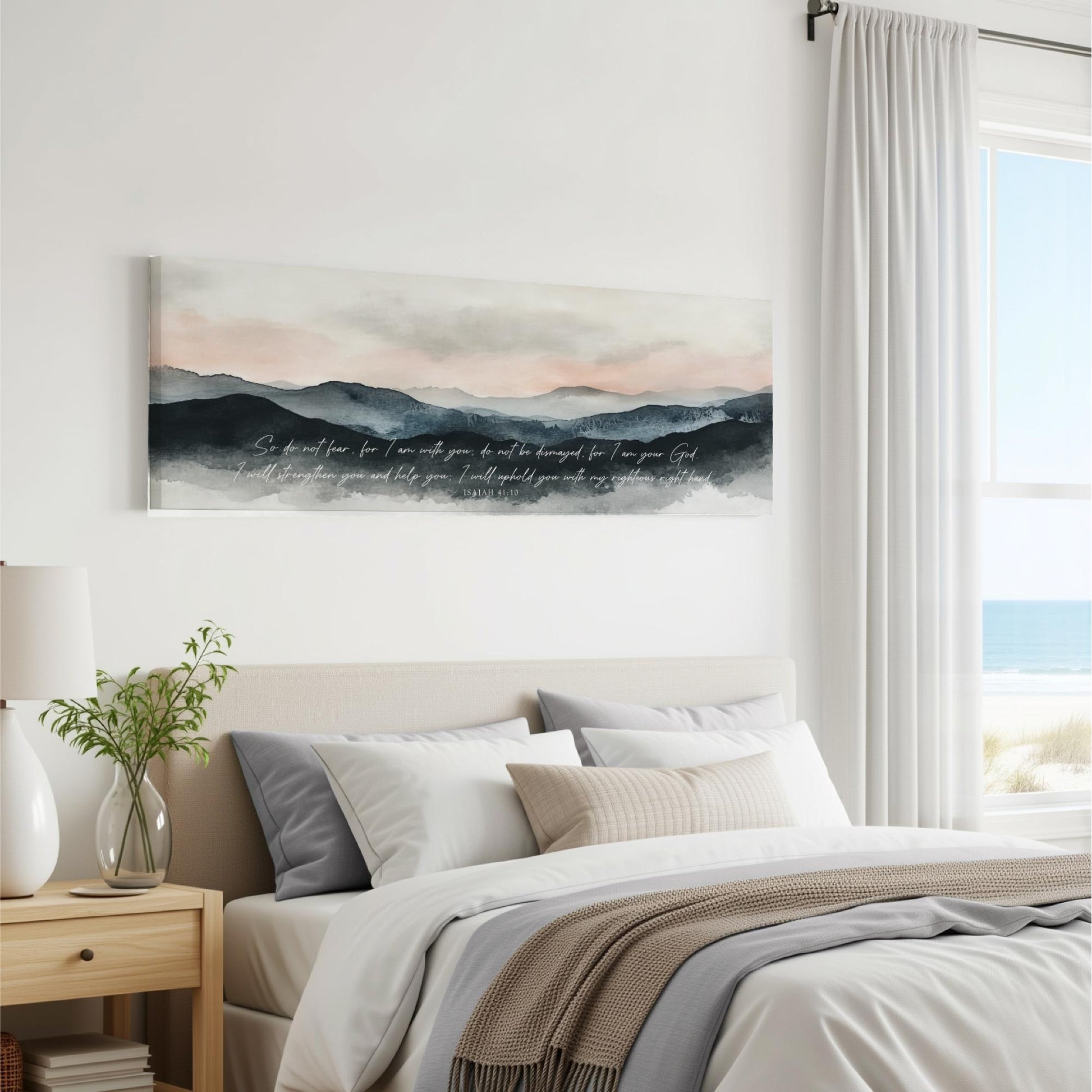 a serene bedroom scene with a large bed, a nightstand, and a painting of a mountain landscape hanging on the wall.