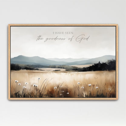 The image is a framed painting depicting a serene landscape with a field of flowers and mountains in the background.