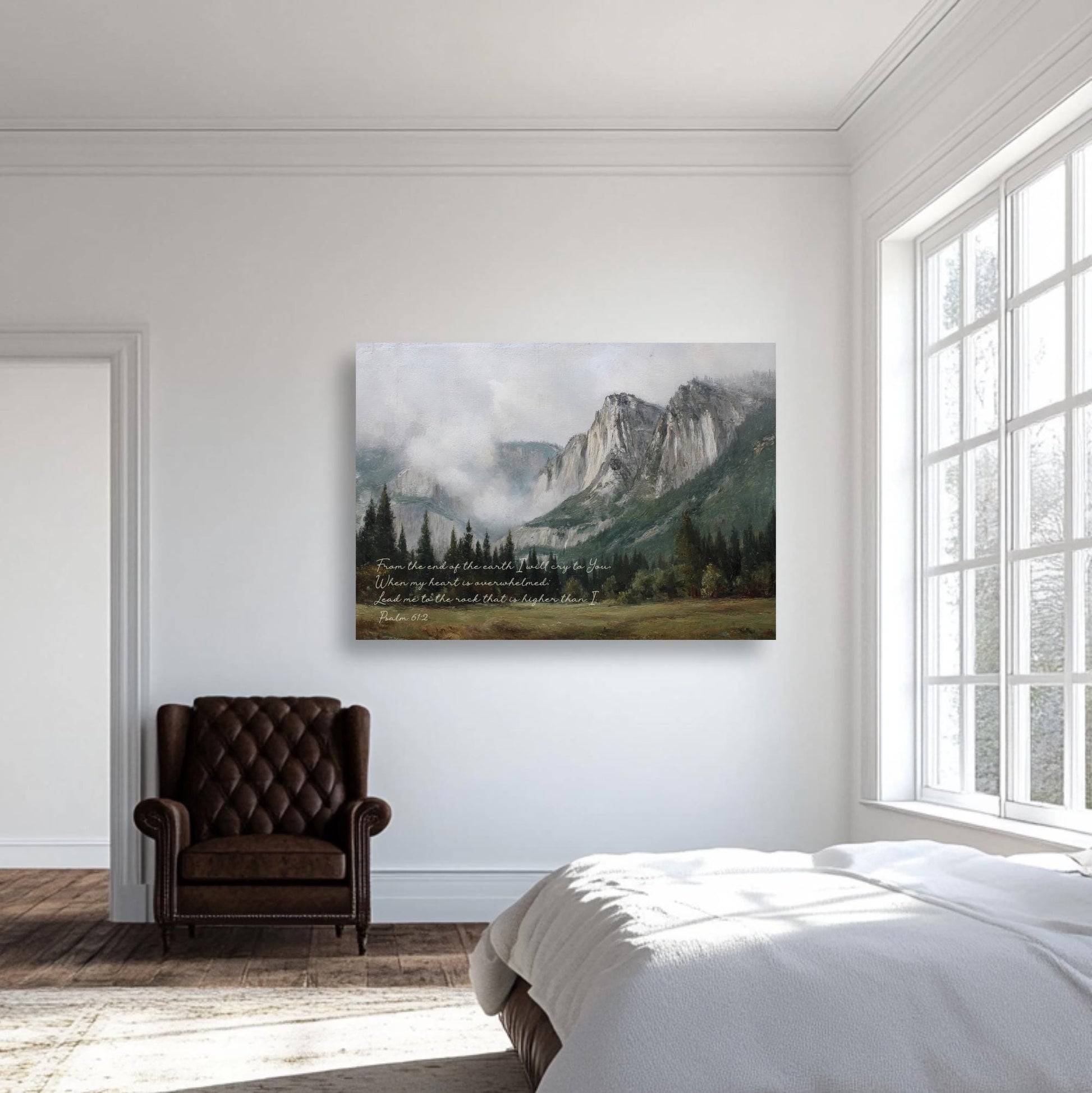 a serene bedroom scene with a large window overlooking a picturesque mountain landscape. The room is adorned with a brown leather armchair and a white bed, creating a cozy and inviting atmosphere. The room is illuminated by natural light streaming in through the window, highlighting the tranquil setting.