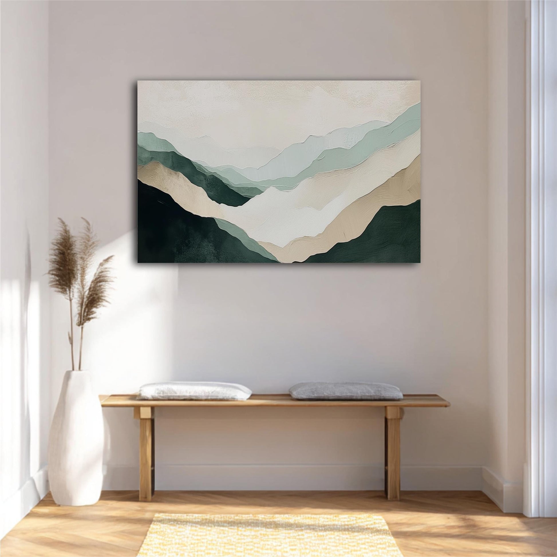 a minimalist interior design with a large abstract painting of mountains hanging on the wall above a wooden bench with two white pillows. The painting has a soothing color palette of green, beige, and gray, creating a serene and calming atmosphere in the room.